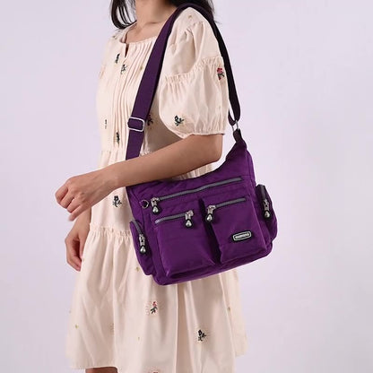 Nouveau Chic - Sac bandoulière femme étanche avec poches multiples - Rynova