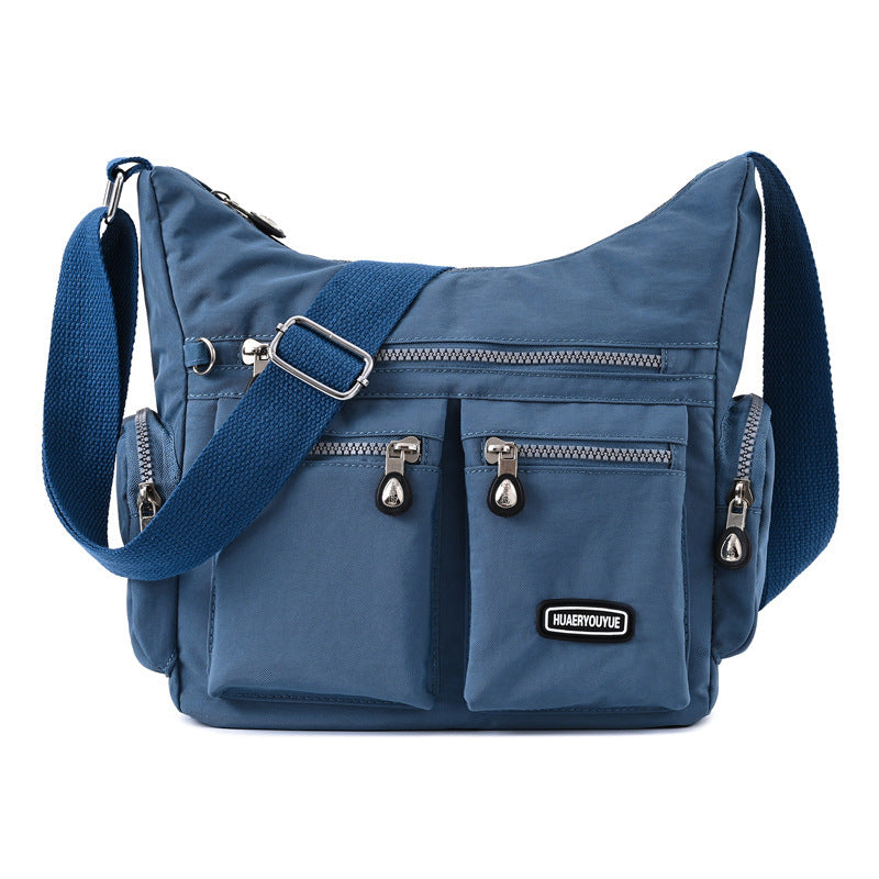 Nouveau Chic - Sac bandoulière femme étanche avec poches multiples - Rynova